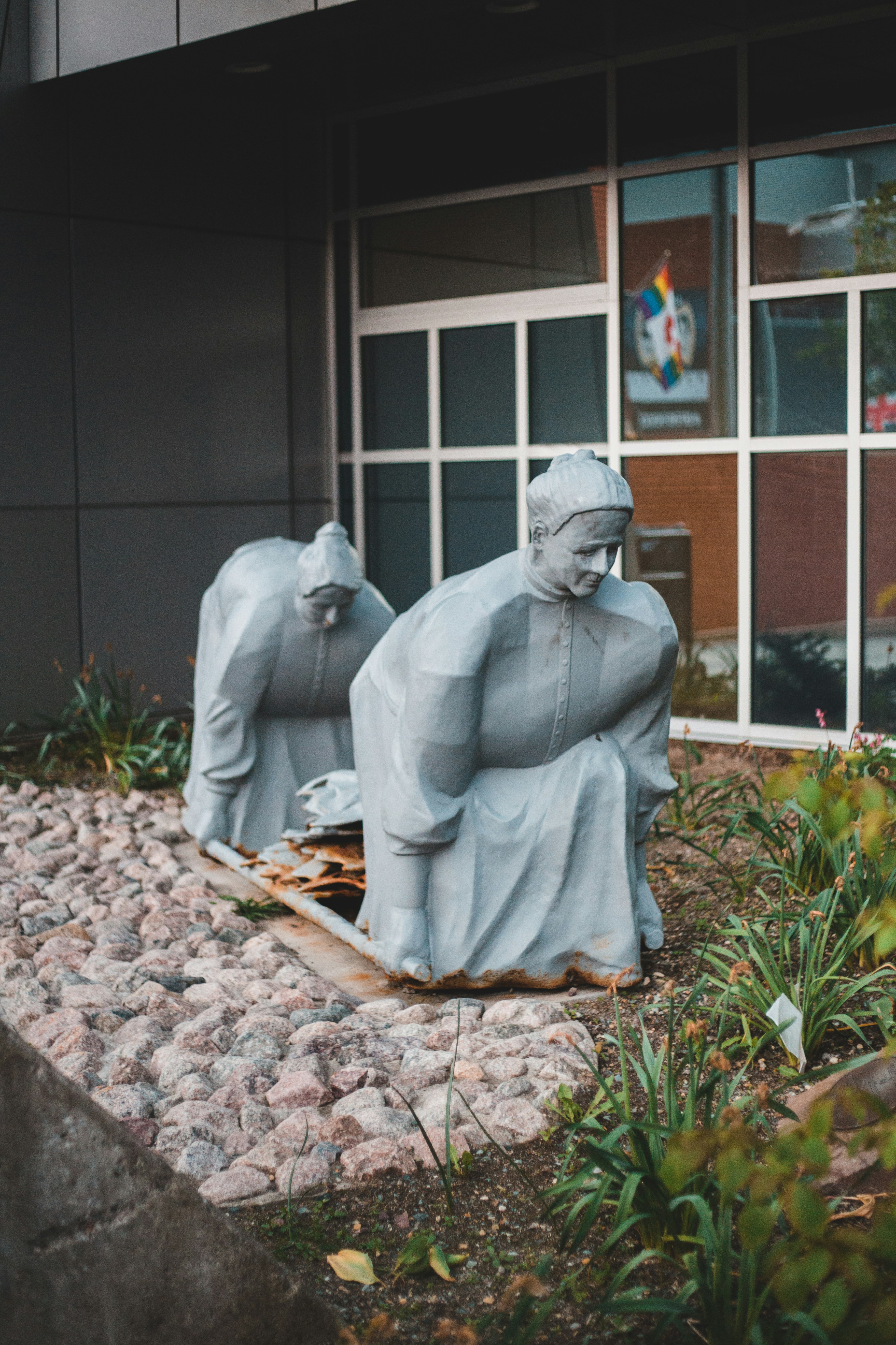 white concrete statue of man